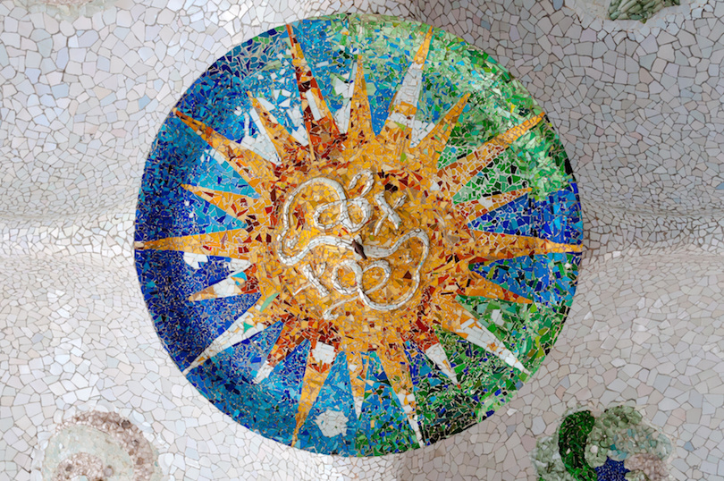 Season mosaic with orange sun at sala Hipostila in Park Guell at Barcelona