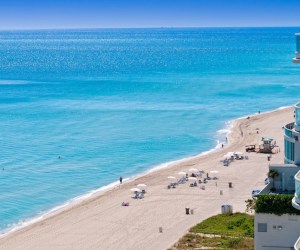 View of the beach and ocean with tourists relaxing